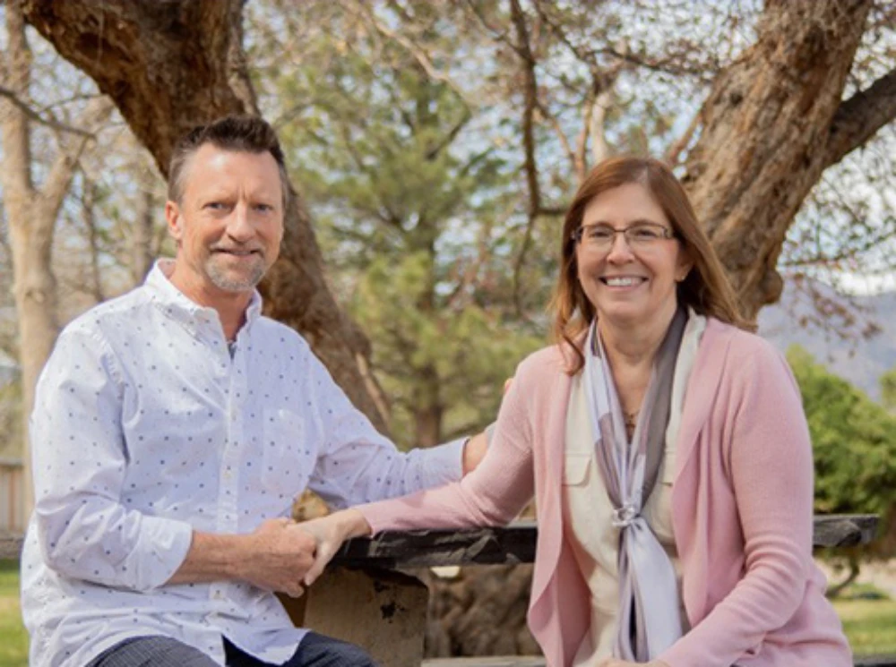 David and Lisa Rickman David and Lisa Rickman sitting next to each other holding hands